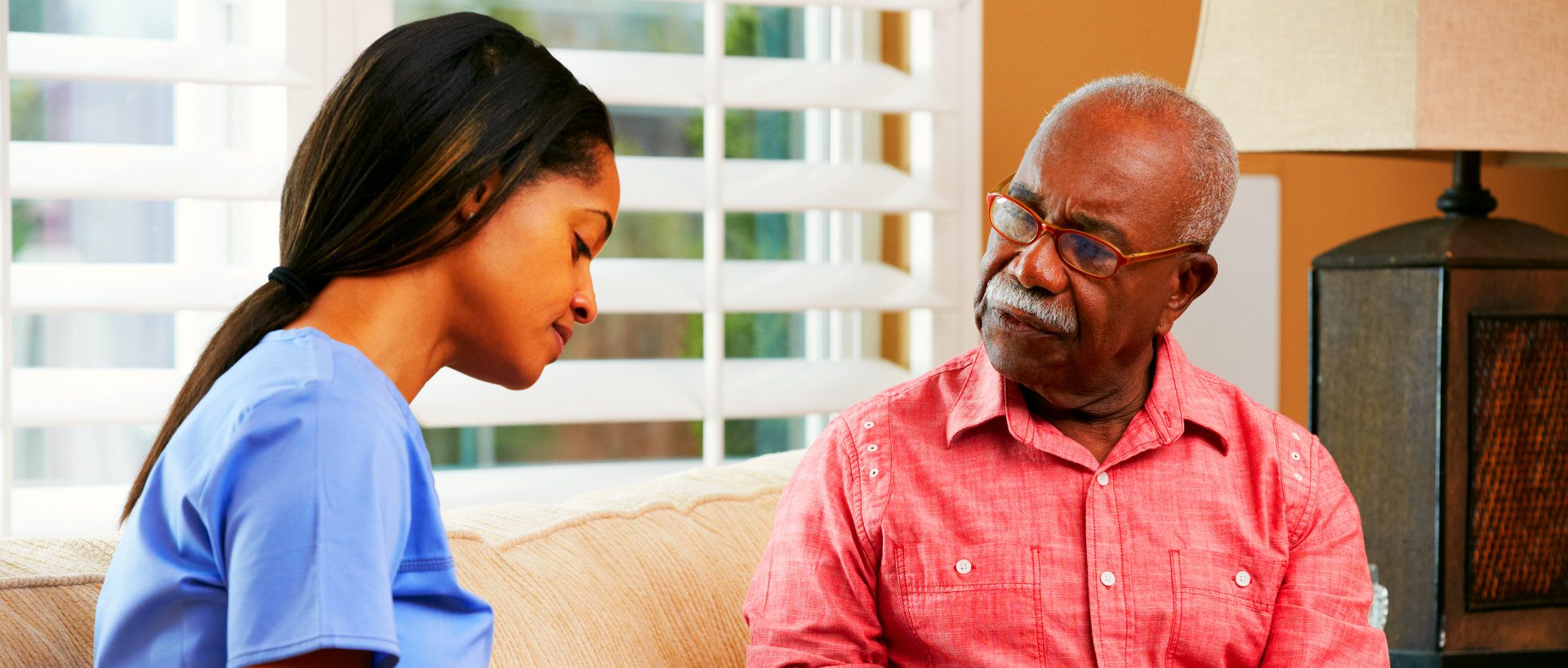 a female caregiver with an elderly man